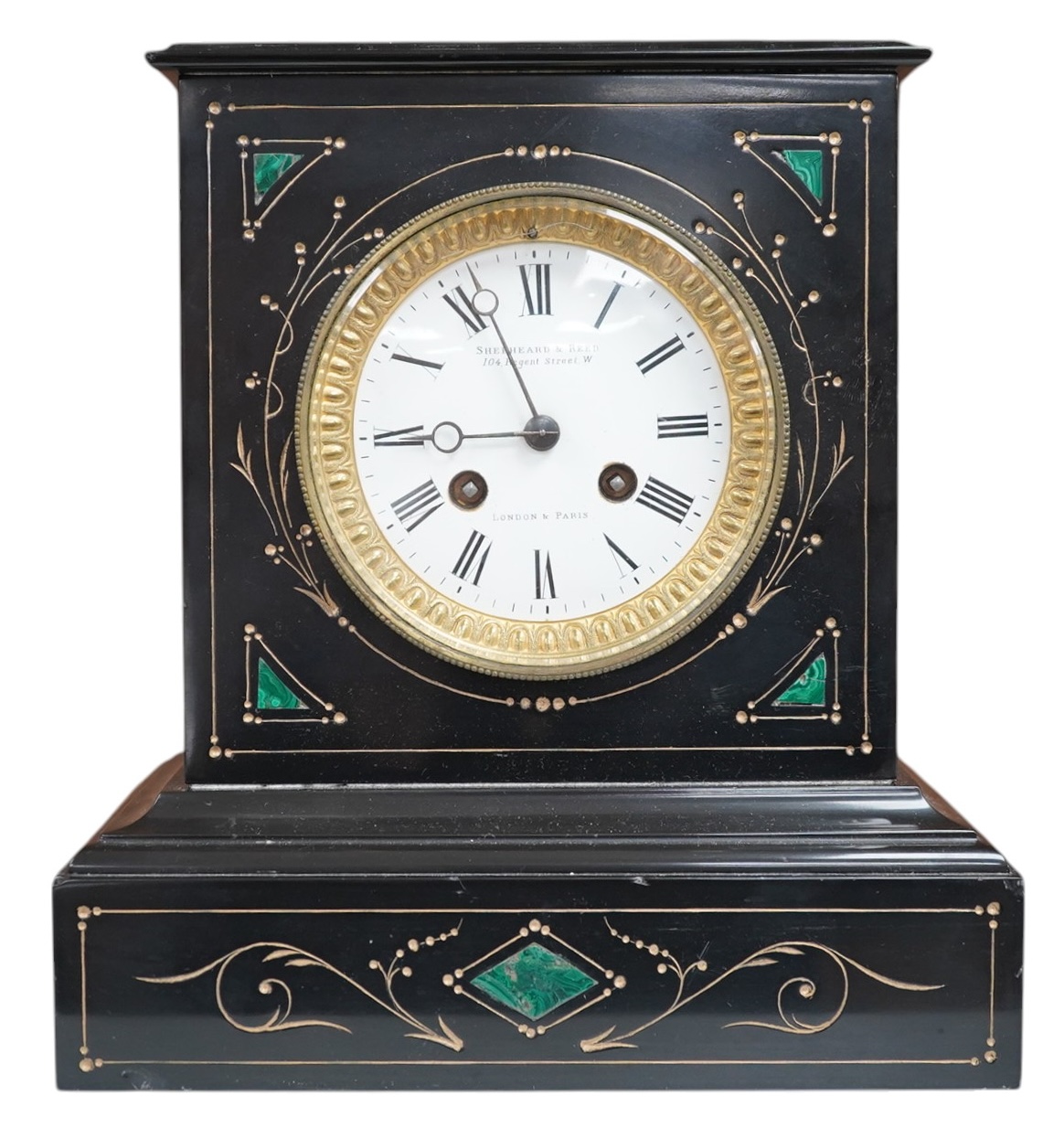 A late 19th century, French black marble eight day mantel clock, inset with malachite, retailed by Shepheard & Rees, with pendulum, no key, 26cm high. Condition - fair, minor chipping, untested